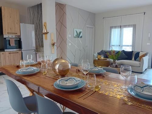 a dining room table with wine glasses on it at B&B Tra colline marchigiane - sauna e piscina in San Giorgio di Pesaro