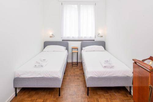 Katil atau katil-katil dalam bilik di Residenza Gigli