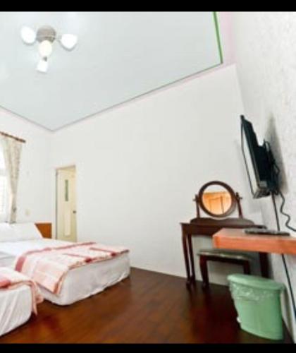 Una cama o camas en una habitación de 豐富民宿