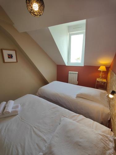 Postel nebo postele na pokoji v ubytování Résidence Leclerc - Appartements d'hôtes - Secteur thermal