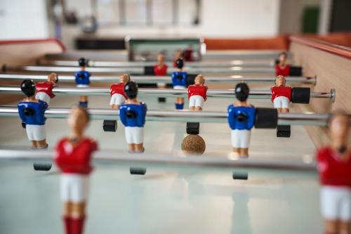 a group of toy dolls in a ping pong court at Villa Maya in Tendu