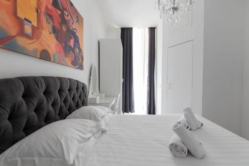 Postel nebo postele na pokoji v ubytování FCR Rome Apartments Gracchi Vatican