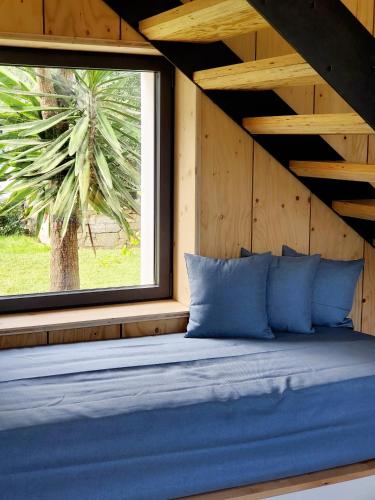 a bed in a room with a window at Luxury Bali Villa in Hossegor 5 stars- Pool & Petanque in Hossegor