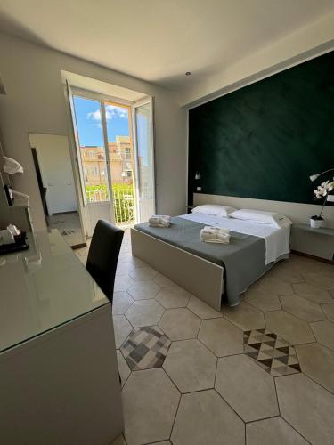 Katil atau katil-katil dalam bilik di Don Ugo Luxury Rooms