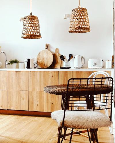 a kitchen with a table and two chairs at Appartement Casadilonda - Casadibastia - Vue mer Citadelle in Bastia