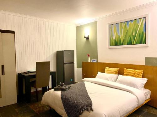 Una cama o camas en una habitación de Horison Meyer Guest Suites