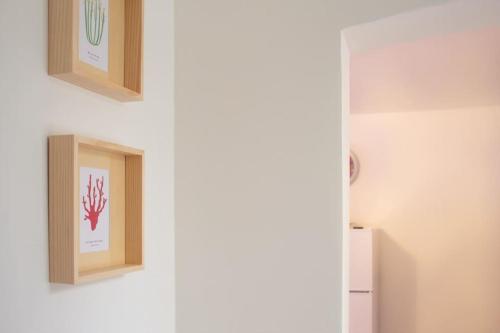 a room with two pictures on a wall at Lovely apartment in the heart of Pula in Pula