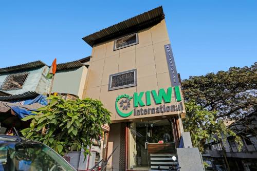 a building with a kiwi sign on it at Hotel O Kiwi International in Mumbai