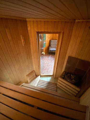 an inside view of a sauna with a window at Opushka in Vorobʼyëvka