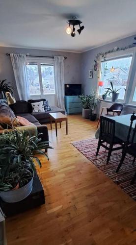 a living room with a couch and a table at Villa i Västervik in Västervik