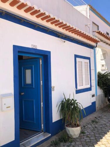 a blue and white building with a blue door at Villa Marie e Villa Marieke Ferragudo by Rosado in Ferragudo