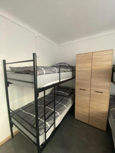Ένα ή περισσότερα κρεβάτια σε δωμάτιο στο Hostel Harmonia