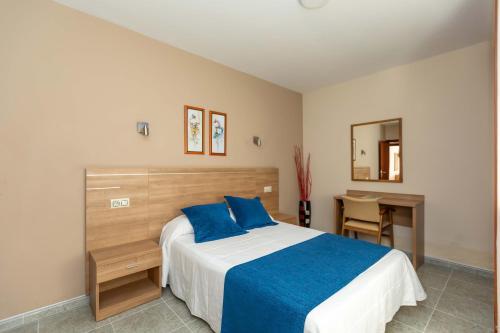 Cama o camas de una habitación en Hotel Foxos