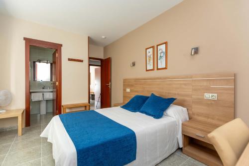 Cama o camas de una habitación en Hotel Foxos