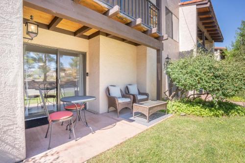 a patio with chairs and a table and a table at Cozy Sedona Retreat - Pool, Spa, Pickleball in Sedona