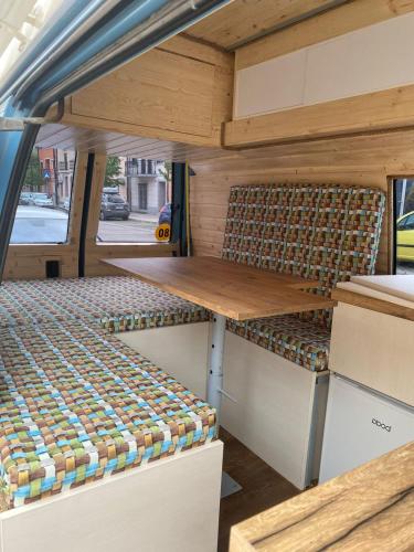 a table and chairs in the back of a van at GoCamping Montenegro in Cetinje