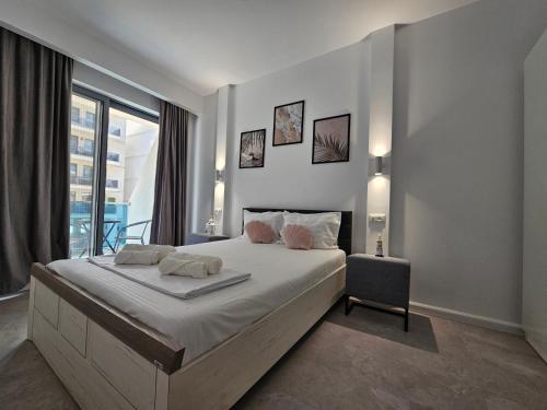Ένα ή περισσότερα κρεβάτια σε δωμάτιο στο Wave SeaView Apartment
