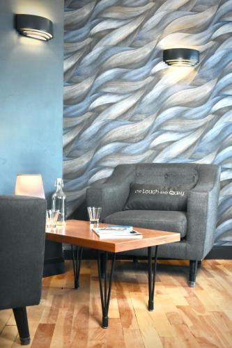 a living room with a couch and a table at The Lough & Quay Accommodation in Warrenpoint