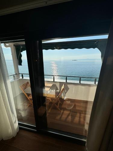 a view of the ocean from the balcony of a boat at ADOS Otel in Marmara