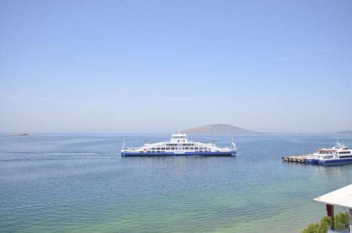 two boats in a large body of water at ADOS Otel in Marmara