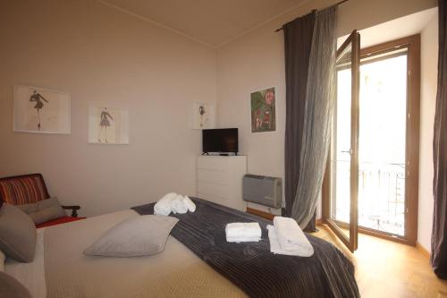 a bedroom with a bed with two towels on it at Civico 9 in Viterbo