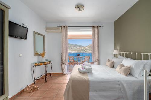 Ένα ή περισσότερα κρεβάτια σε δωμάτιο στο Niovi Seaview Apartments