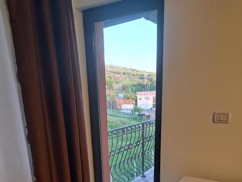 a door leading to a balcony with a view at Apartament Teo in Iaşi