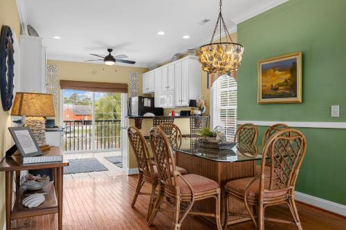 a kitchen and dining room with a table and chairs at Shealy's Seaclusion in Myrtle Beach