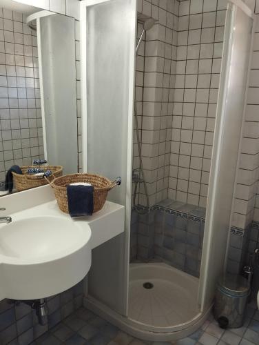 a bathroom with a sink and a shower at V.K.Seaside Villa in Volos