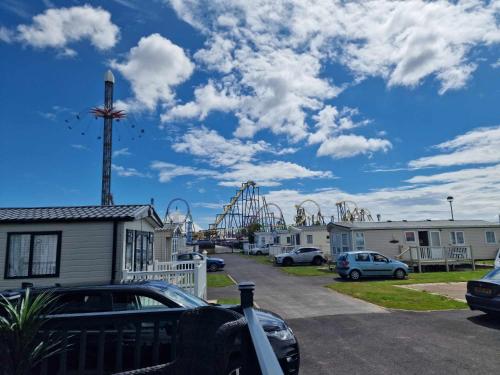 a view of a roller coaster in a parking lot at Thrillseeker - next to Fantasy Island, Ingoldmells, dog friendly in Skegness