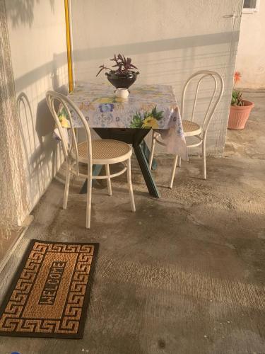 a table and chairs sitting on a patio at Nuccia'S House in Reggio Calabria