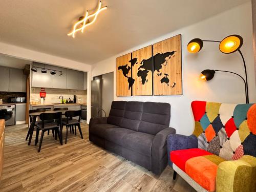 a living room with a couch and a table at Casa da Ribeira in Vila do Bispo