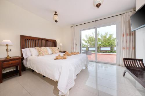 En eller flere senge i et værelse på Casa Knala - Quiet and BBQ