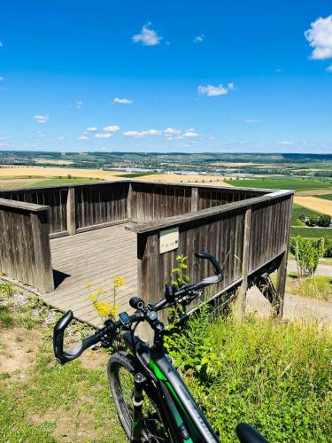 a bike parked in front of a wooden building at Appartments - Stromberg & Zabergäu in Erligheim