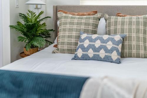 a bedroom with a bed with pillows at Swanky Studio in Vibrant Hillcrest in San Diego