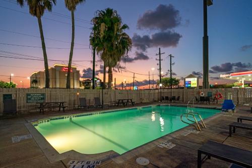 a swimming pool in a park at night at La Quinta Inn by Wyndham Corpus Christi North in Corpus Christi
