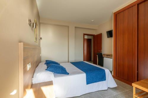 Cama o camas de una habitación en Hotel Foxos