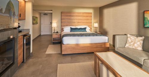 a hotel room with a bed and a couch at Surfsand Resort in Cannon Beach