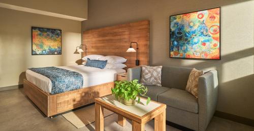 a hotel room with a bed and a couch at Surfsand Resort in Cannon Beach