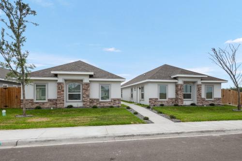 a house on a street with a fence at Peaceful & Cozy Hideaway Unit #1 in Edinburg
