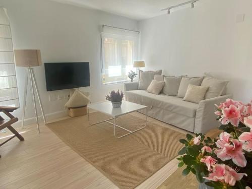 Et tv og/eller underholdning på NUEVO! Apartamento al lado de la Catedral