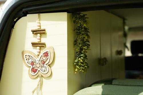 a butterfly decoration on the side of a window at Montenegro Camper VOYAGER in Podgorica