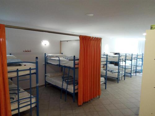 a group of bunk beds in a room at Albergue @ Muxia in Muxia