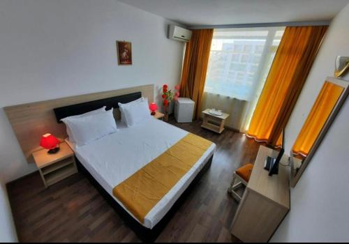 Postel nebo postele na pokoji v ubytování Hotel Apollo