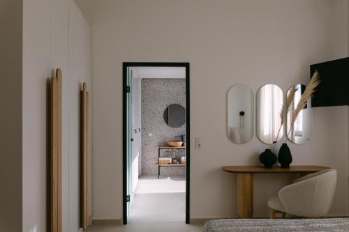 a hallway with a door leading into a room at Emerald Harmony Villa with Private Pool & Jacuzzi in Skouloúfia