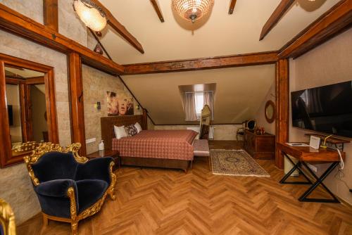 a bedroom with a bed and a flat screen tv at Haus Thomas in Dortmund