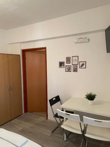 a dining room with a table and chairs at TIKI Apartments in Gevgelija
