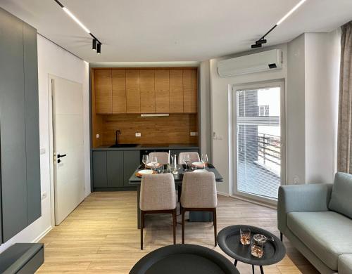 a living room with a table and a couch at SUV ApartHotel in Pogradec