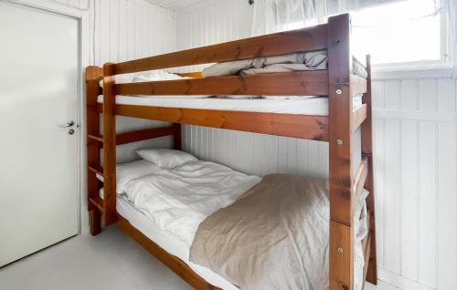 a couple of bunk beds in a room at 1 Bedroom Beautiful Home In Borås in Borås