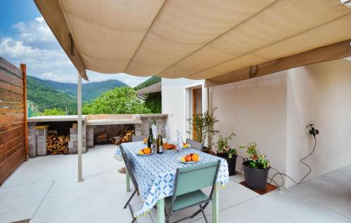 a patio with a table with oranges on it at 3 Bedroom Awesome Home In Lamon in Lamon